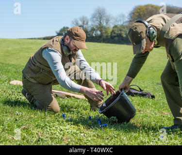 collecting empty cartridges after shooting Stock Photo