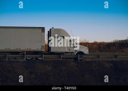 Semi truck 18 wheeler on highway Stock Photo