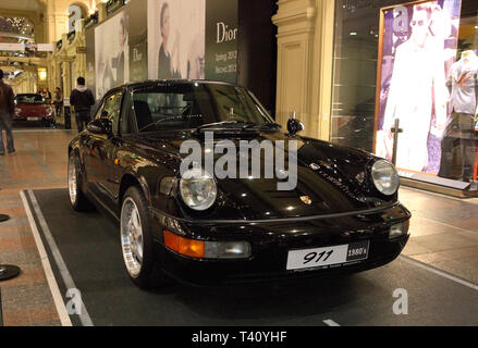 luxury Supercar Porsche 911 parked next to Gum mall in Moscow, shoot in night Stock Photo