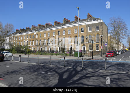 Elegant terrace of Georgian houses on Bow Road in London's East End, UK. Corner of Tredegar Square. Most now converted to flats. Stock Photo