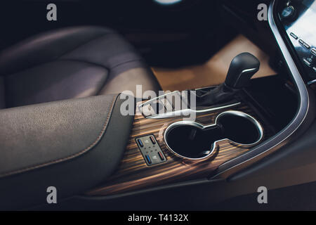 Close up view of a gear lever shift. Manual gearbox. Car interior details. Car transmission. Soft lighting. Abstract view. Stock Photo