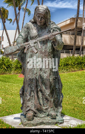 Miami, USA - 10. April 2014: This large bronze statue of Mother Teresa is one of nine works in Bayfront Park for Art Basel. The exhibit titled WAR to  Stock Photo