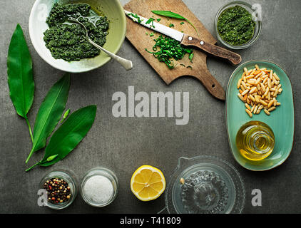 Fresh ramson or wild garlic with ingredients for pesto- Image. Healthy spring food concept Stock Photo