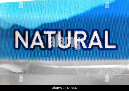 Natural printed on label in plastic disposable water bottle, close-up Stock Photo