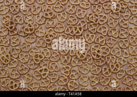 Still life of pretzels against a wooden background Stock Photo