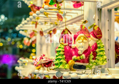 hanging  santa claus christmas decorations in berlin shop Stock Photo