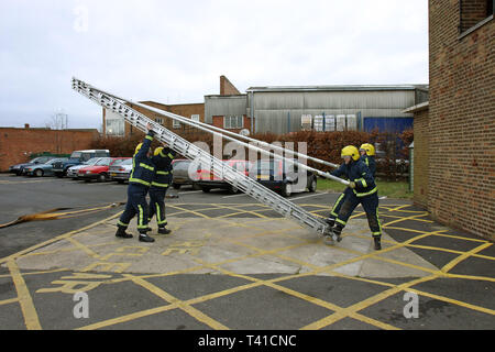 Firemen simulate a fire on a third floor of a building. Stratford Fire Station 7/01/2005 Stock Photo