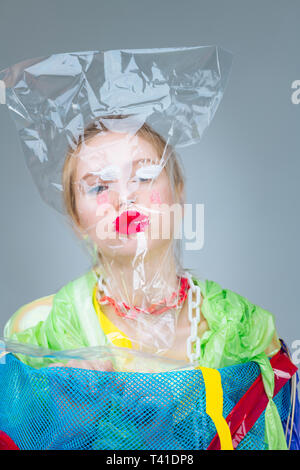 Bag on head. Professional model with plastic bag on her head taking part in social anti-plastic campaign Stock Photo
