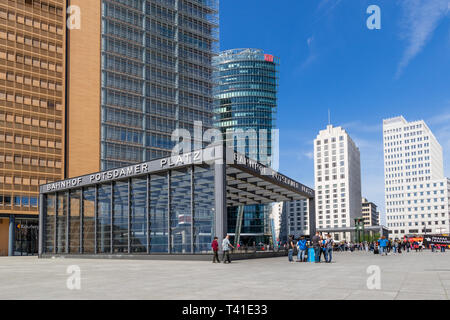 BERLIN - APR 28, 2018: Highrise and entrance to the railway station in Potsdamer Platz. One of the main public square and traffic intersection in the  Stock Photo