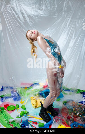 Showing nice poses. Blonde-haired professional model showing nice poses for ecology promotion Stock Photo