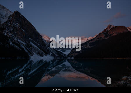 Sunrise over Mount Victoria and Mount Fairview by Lake Louise, Banff National Park, Canada Stock Photo