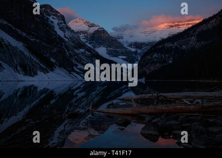 Sunrise over Mount Victoria and Mount Fairview by Lake Louise, Banff National Park, Canada Stock Photo