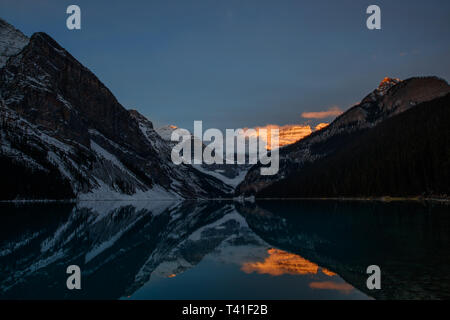 Sunrise over Mount Victoria and Mount Fairview by Lake Louise, Banff National Park, Canada Stock Photo