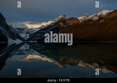 Sunrise over Mount Victoria and Mount Fairview by Lake Louise, Banff National Park, Canada Stock Photo