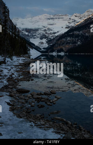 Sunrise over Mount Victoria and Mount Fairview by Lake Louise, Banff National Park, Canada Stock Photo