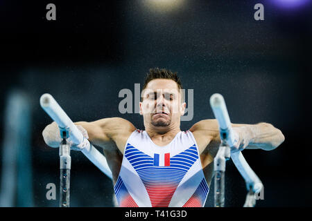 Paul Degouy from France seen in action on the parallel bars during the Men's All-Around Final of 8th European Championships in Artistic Gymnastics. (Day 3) Stock Photo