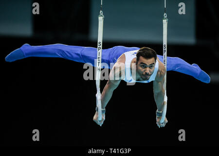 Ferhat Arican from Turkey seen in action on the rings during the Men's All-Around Final of 8th European Championships in Artistic Gymnastics. (Day 3) Stock Photo