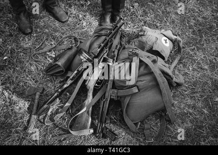 Soviet Russian Military Infantry Ammunition On Ground World War II Soviet Red Army Weapon. Submachine Guns PPS-43 And PPSh-41 On Ground. WWII WW2 Russ Stock Photo