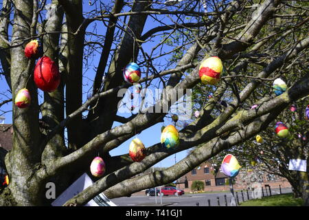 Deocrated eggs on trees in Princes Risborough, Buckinghamshire, UK. Created by local children, to celebrate the Easter Weekend 2019 Stock Photo
