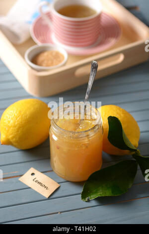 lemon jam in the glass jar with fruit around - closeup Stock Photo