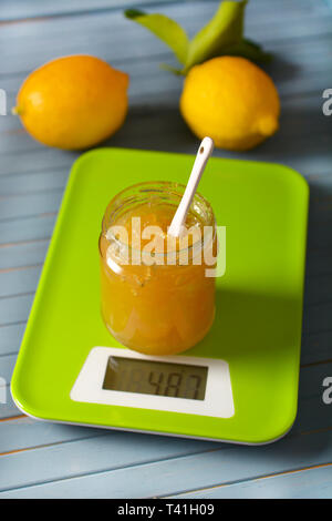 lemon jam in the glass jar with fruit around - closeup Stock Photo