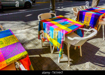 Colorful Blankets on Tables Valencia Street Bar Ruzafa Valencia Russafa District Sidewalk Lunchtime Spanish bar Russafa Valencia Spain Europe City Stock Photo