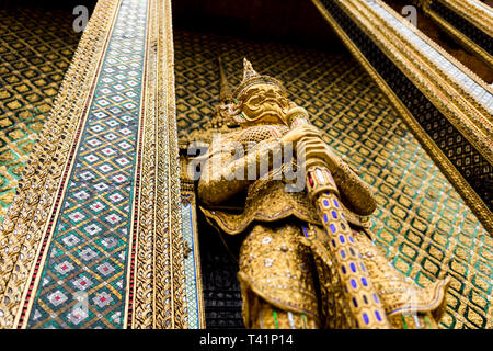 Golden Statue at The Grand Palace in Bangkok, Thailand.