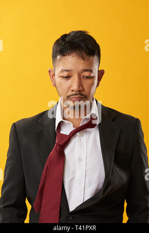 Asian bankrupcy theme. Young asian man after bad day in office Stock Photo