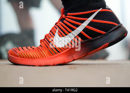 San Diego, CA / USA - April 12, 2019: Red Nike flyknits being worn while working out Stock Photo