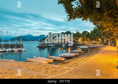 Big Italian lake at dawn. Lake Maggiore and Laveno with its small port Stock Photo