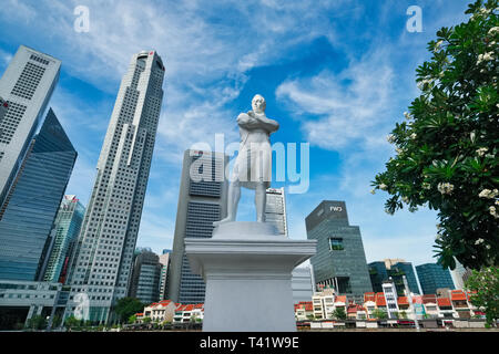 The statue of Sir Stamford Raffles at Raffles Landing Site, Boat Quay, Singapore, the buildings of the financial district in the background Stock Photo