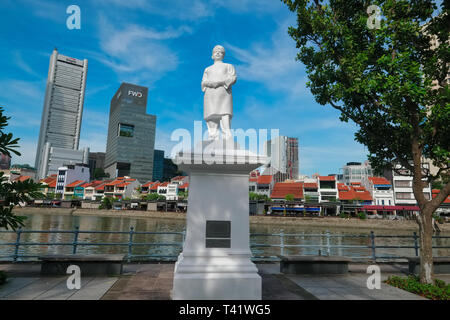 The statue of Singapore pioneer Naraina Pillai at Boat Quay, Singapore, the buildings of the financial district in the background Stock Photo