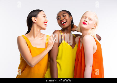 Women with different skin color wearing bright colorful clothes