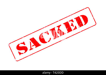 Rubber stamp concept showing a red stamp reading Sacked Stock Photo