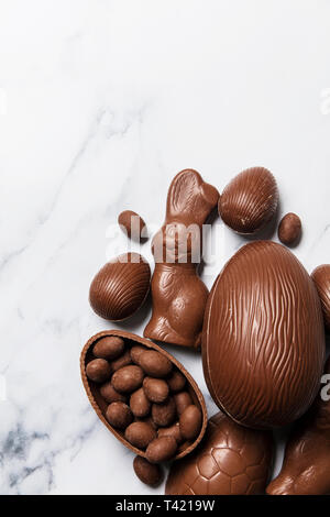 Chocolate easter eggs and bunnies on a marble background Stock Photo