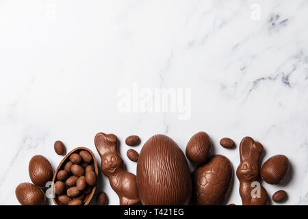 Chocolate easter eggs and bunnies on a marble background Stock Photo