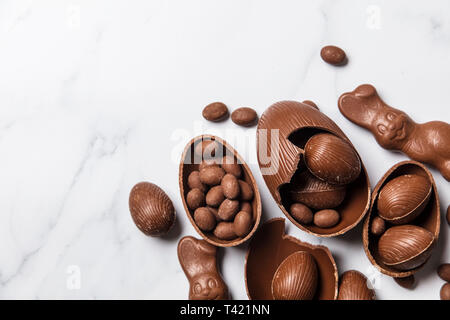 Chocolate easter eggs and bunnies on a marble background Stock Photo