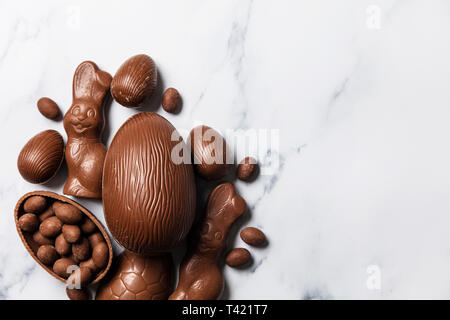 Chocolate easter eggs and bunnies on a marble background Stock Photo