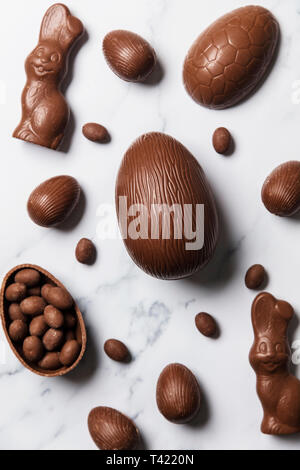 Chocolate easter eggs and bunnies on a marble background Stock Photo
