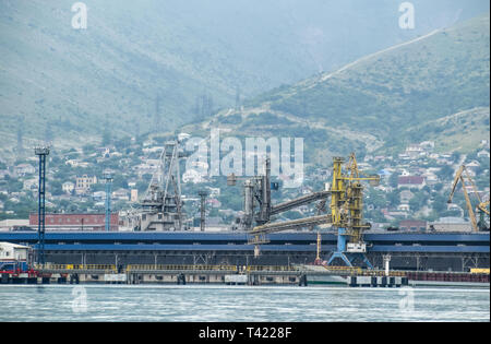 Novorossiysk, Russia - May 28, 2016: The international sea port of Novorossiysk. Port cranes and industrial objects. Marine Station. Stock Photo