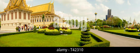 Phnom Penh, Cambodia - March 4, 2019:  Tourists outside buildings of the Royal Palace in Phnom Penh, Cambodia. Stock Photo