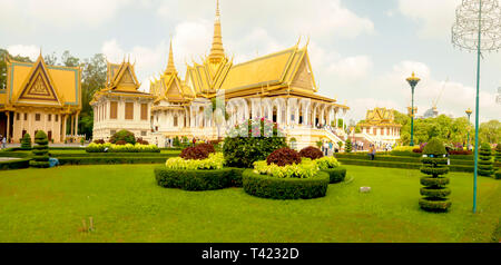 Phnom Penh, Cambodia - March 4, 2019:  Tourists outside buildings of the Royal Palace in Phnom Penh, Cambodia. Stock Photo