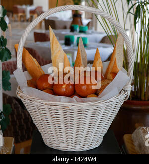 assorted breads in a basket Stock Photo