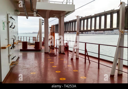 The deck of a cargo ship. Red floor and white walls Stock Photo