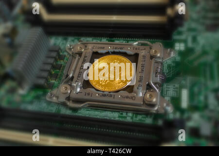 Asic farm mining for shiny golden bitcoin cryptocurrency Stock Photo