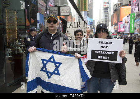 Pro Israel Trump supporters demonstrate outside a pro-Palestinian rally. Muslims rally and march in New York CIty after the New Zealand massacre and for the Palestinians in Gaza as well as against Islamophobia in general. Stock Photo