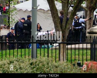 Washington, USA. 12th Apr 2019. An unidentified person is attended to by United States Secret Service and US Park Police during an incident in Lafayette Park, across Pennsylvania Avenue from the White House in Washington, DC on April 12, 2019. Credit: Ron Sachs/CNP /MediaPunch Credit: MediaPunch Inc/Alamy Live News Stock Photo