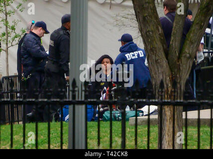 Washington, USA. 12th Apr 2019. An unidentified person is attended to by United States Secret Service and US Park Police during an incident in Lafayette Park, across Pennsylvania Avenue from the White House in Washington, DC on April 12, 2019. Credit: Ron Sachs/CNP /MediaPunch Credit: MediaPunch Inc/Alamy Live News Stock Photo