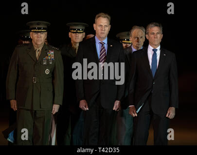 Members of the Official Party, including Governor John Carney (Democrat of Delaware), US Marine Corps General Robert B. Neller, Commandant of the Marine Corps, acting US Secretary of Defense Patrick M. Shanahan, and US Senator Tom Carper (Democrat of Delaware), pay their respects during the Dignified Transfer of the remains of United States Marine Corps Staff Sergeant Christopher A. Slutman at Dover Air Force Base in Dover, Delaware on April 11, 2019.  Members of the Official Party, including Governor John Carney (Democrat of Delaware), Sergeant Major of the United States Marine Corps Ronald G Stock Photo