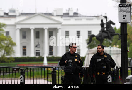 Washington, USA. 12th Apr, 2019. Secret Service agents are seen outside the White House in Washington, DC, the United States, on April 12, 2019. A man set his jacket on fire outside the White House on Friday afternoon, according to the U.S. Secret Service. Credit: Liu Jie/Xinhua/Alamy Live News Stock Photo